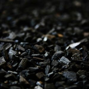 Detailed Close Up Of Charcoal Briquettes Showing Textures And Shades.