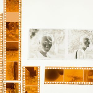 Colorful Film Strips And Photo Negatives Arranged On A Light Table For A Creative Display.