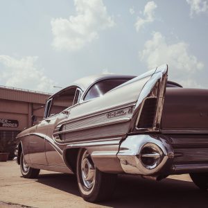 Classic Buick Roadmaster Captured On A Sunny Day Showcasing Its Vintage Tail Fins And Chrome Details.