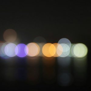 Colorful Bokeh Lights Creating A Blurred Effect In A Night Scene.