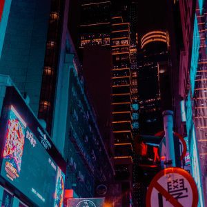 Explore The Vibrant Neon Lit Streets Of Kowloon, Hong Kong, Capturing The Bustling Nightlife And Urban Allure.