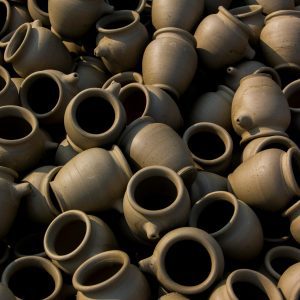 A Multitude Of Handcrafted Clay Pots Artistically Arranged, Showcasing Traditional Pottery Techniques.
