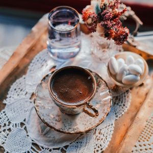 Charming Arrangement Of Turkish Coffee, Dried Flowers, And Sweets On A Decorative Tray.
