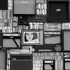 Vintage Amplifiers And Vinyl Records Arranged In A Striking Black And White Pattern.