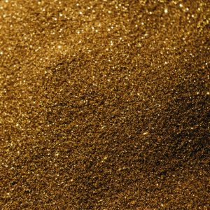 Close Up Of Sparkling Golden Sand, Perfect For Backgrounds And Textures.