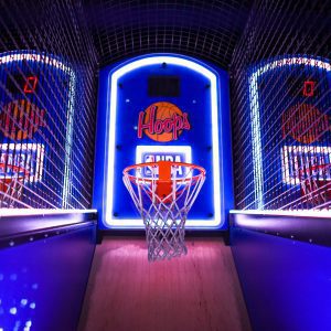 A Colorful Indoor Arcade Game Showcasing Basketball Hoops In A Vibrant Setting, Perfect For Entertainment Venues.