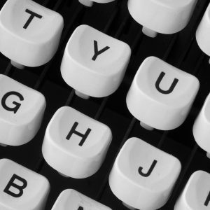 Black And White Close Up Of Retro Typewriter Keys Showcasing Vintage Charm.