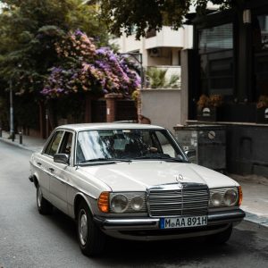 Classic Mercedes Benz W123 Parked On A Quiet Street In Istanbul, Featuring A Vintage Look.