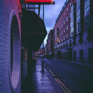 Atmospheric Street Scene In Dublin With Neon Lights At Night.