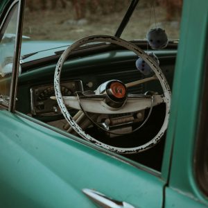 Explore The Classic Elegance Of A Teal 1950s Car Interior Parked In Portland.