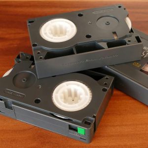 Close Up Of Vintage VHS Tapes Highlighting Retro Electronics And Obsolete Technology.