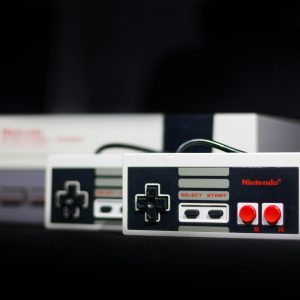Close Up Of A Classic Nintendo Console And Controllers, Symbol Of Retro Gaming.