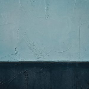 Detailed Textured Wall Art Showcasing Vintage Style With Contrasting Blue Tones.