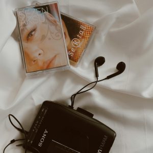 Vintage Walkman With Cassettes, Embodying Nostalgia And Retro Style.
