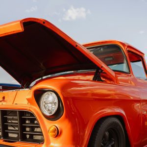 High Quality Close Up Of A Vintage Orange Car With Open Hood, Captured In Reno Under Clear Skies.