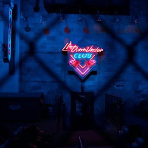 Moody Nightclub Interior With Vibrant Neon Lights Creating A Retro Ambiance.