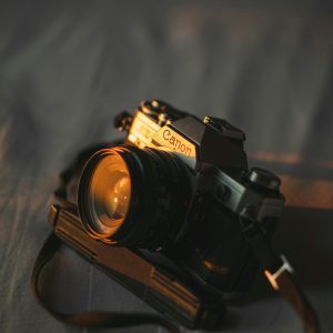 Close Up View Of A Vintage Film Camera With A Lens, Capturing A Classic Photography Vibe.