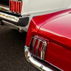 Retro Red And White Muscle Cars Highlighting Their Iconic Taillights.
