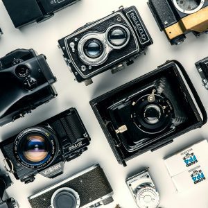 Flat Lay Of Various Vintage Cameras Showcasing Classic Design And Retro Charm.