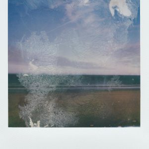 A Vintage Polaroid Image Of A Seaside Landscape With A Distressed, Artistic Effect, Evoking Nostalgia And Tranquility.