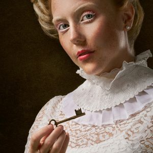 Portrait Of A Victorian Woman In Lace Holding An Antique Key.