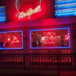 Iconic Diner In Athens, GA, Lit By Vibrant Neon Signage Displaying 'Open 24 Hours.'