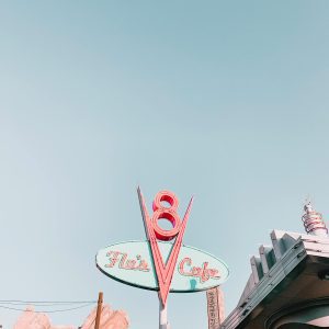 Low Angle Shot Of The Iconic Flo's V8 Cafe Sign Under A Clear Sky In Disneyland.