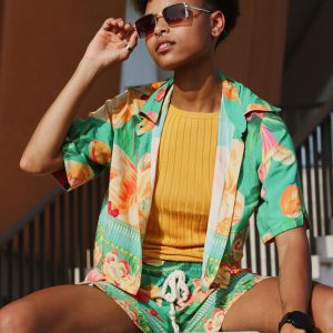 Stylish Woman In Summer Attire Posing Outdoors With Sunglasses In Berlin.