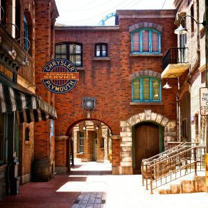 Capture Of A Vintage Style Urban Street With Brick Facades And Unique Architectural Details.