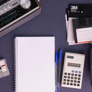 Retro Flat Lay Featuring Vintage Technology And Office Supplies, Highlighting 80s Nostalgia.