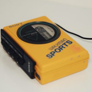 Retro Yellow Sony Walkman Sports Cassette Player With Stereo Feature.
