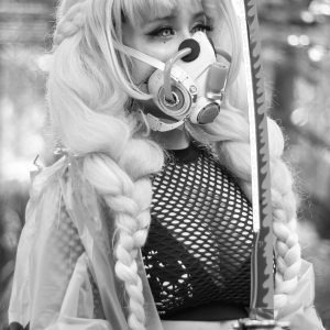 Black And White Image Of A Fashionable Woman Wearing A Mask And Holding A Sword, Exuding A Futuristic And Dramatic Vibe.