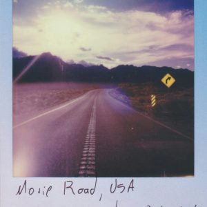 Retro Style Polaroid Photo Of Mojave Road With A Scenic Sunset Backdrop In The USA.