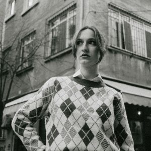 Black And White Portrait Of A Woman In Vintage Attire, Urban Setting.