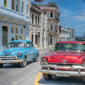 Classic American Cars On A Bright Havana Street, Showcasing Retro Charm And Vibrant Architecture.