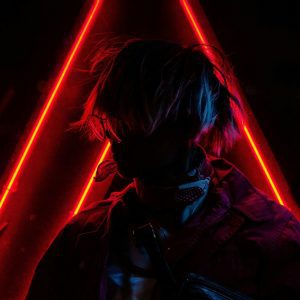 A Fashionable Silhouette Of A Person Posing Against Vibrant Red Neon Lights.