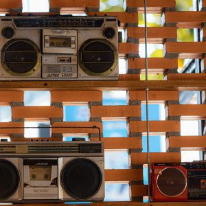 Collection Of Vintage Boom Boxes Showcased On A Rustic Brick Wall In Vietnam.