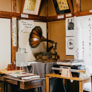 A Cozy Japanese Room In Kawagoe With Vintage Phonograph, Calligraphy, And Traditional Decor.