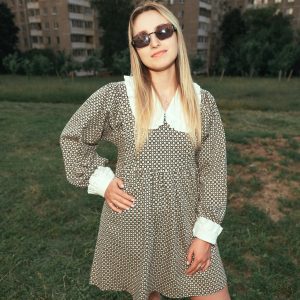 Stylish Woman In Sunglasses And Vintage Dress Posing Outdoors.