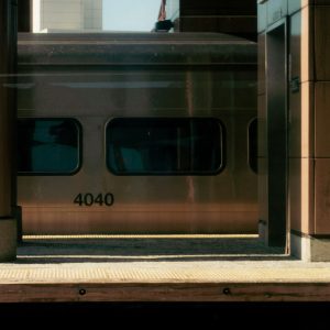 Warm Morning View Of A Train At A Sunny New York City Platform Capturing Vintage Vibes.
