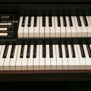 High Quality Image Of A Vintage Electric Organ's Keyboard And Control Panel, Perfect For Music Themed Projects.
