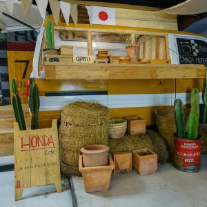 Rustic Camper Cafe Setup With Cacti And Wooden Decor In An Indoor Setting.