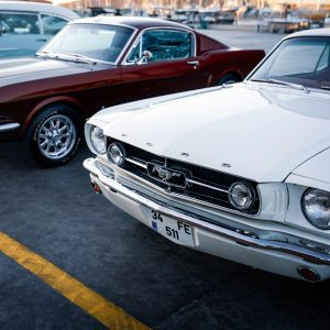 Vintage Ford Mustang Cars Parked By The Marina In İzmir, Türkiye During Sunset.