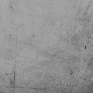 Detailed View Of A Textured Grey Surface With Visible Scratches And Marks.
