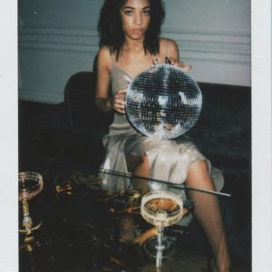 Stylish Woman In Evening Dress With Disco Ball At A Party Setting, Creating A Glamorous And Festive Vibe.