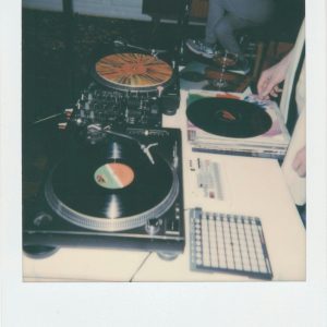 Vintage DJ Setup Featuring Vinyl Records And Turntables, Evoking Nostalgia And Retro Vibes.