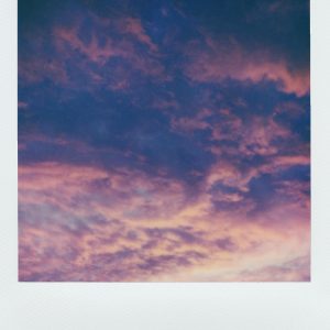 A Serene And Vibrant Twilight Sky Showcasing A Beautiful Cloudscape In Pastel Colors.