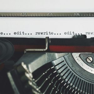 Classic Typewriter With Text 'rewrite... Edit...' On Paper.