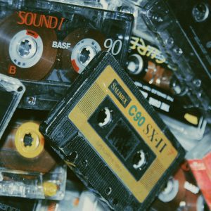 An Assortment Of Vintage Cassette Tapes From The 80s And 90s, Showcasing Retro Design And Nostalgic Appeal.