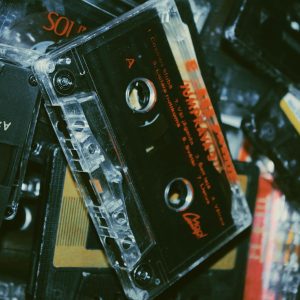 A Nostalgic Close Up Of Various Vintage Cassette Tapes Showcasing Classic Analog Sound.